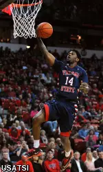 Julien Lewis (14) shoots the ball after stealing it in the second half.