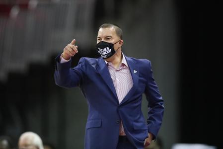 Justin Hutson in suit with Coaches vs. Cancer mask