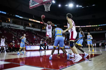 Anthony Holland, driving for lay-up, vs. LIU