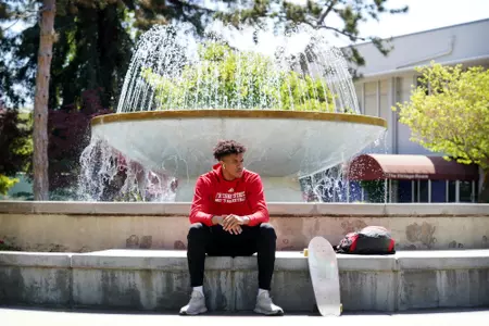 Orlando Robinson, sitting by Fresno State fountain