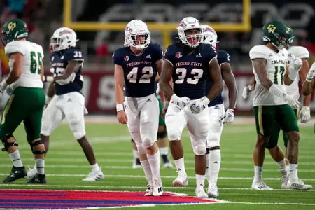 Sep 11, 2021; Fresno, California, USA; Fresno State Bulldogs defensive end Kwami Jones (33) reacts after making a tackle against the Cal Poly Mustangs in the second quarter.