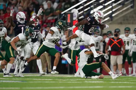 NCAA Football: Cal. PolySep 11, 2021; Fresno, California, USA; Fresno State Bulldogs running back Ronnie Rivers (20) leaps in the air to pick up a first down against the Cal Poly Mustangs in the second quarter.
