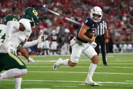 Sep 11, 2021; Fresno, California, USA; Fresno State Bulldogs quarterback Jake Haener (9) runs for a touchdown against the Cal Poly Mustangs in the second quarter.