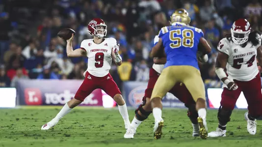 Jake Haener looks to pass the ball at No. 13 UCLA