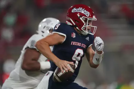 Sep 24, 2021; Fresno, California, USA; Fresno State Bulldogs quarterback Jake Haener (9) runs the ball against the UNLV Rebels in the first quarter.