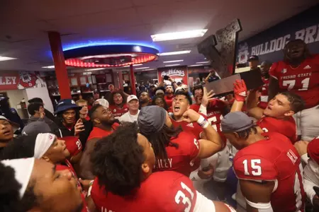 Fresno State celebrates with the Valley Trophy