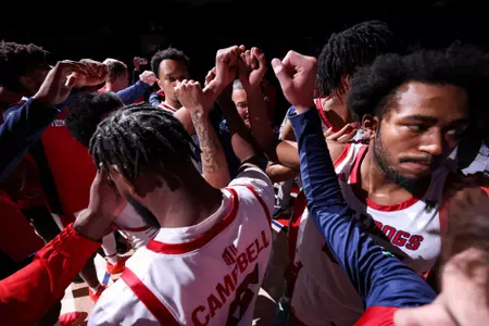 Men's Basketball, team huddle