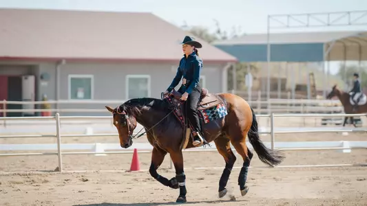Julianne Kelley rides in the reining