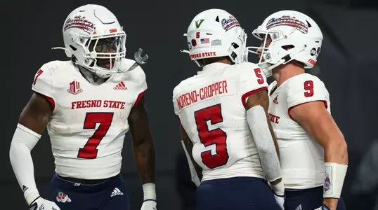 Fresno State seniors Jake Haener, Jalen Moreno-Cropper and Jordan Mims celebrate a touchdown