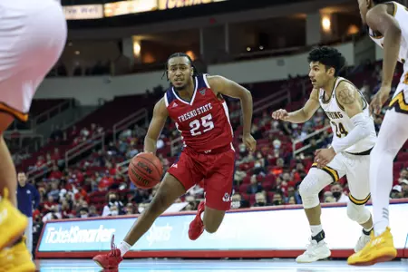 Anthony Holland, driving into the lane, vs. Wyoming