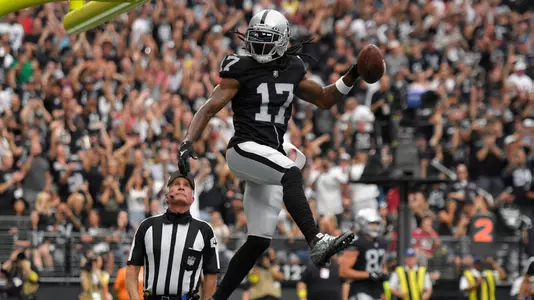 Las Vegas Raiders wide receiver Davante Adams (17) celebrates after a touchdown reception during the first half of an NFL football game against the Arizona Cardinals Sunday, Sept. 18, 2022, in Las Vegas. (AP Photo/David Becker)
