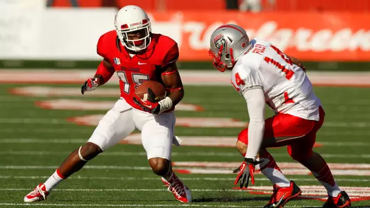 Nov 23, 2013; Fresno, CA, USA; Fresno State Bulldogs wide receiver Davante Adams (15) looks to elude New Mexico Lobos defensive back Tim Foley (14) after making a catch in the second quarter at Bulldog Stadium. Mandatory Credit: Cary Edmondson-USA TODAY Sports