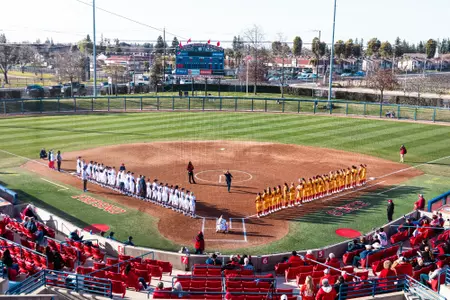Margie Wright Diamond, teams lined up, ceremonial first pitch, vs. Iowa State