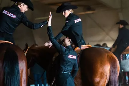 equestrian horsemanship team celebrates together