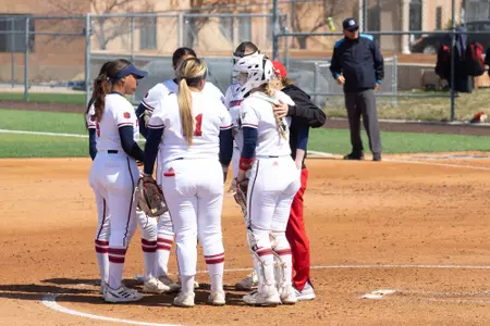 Team huddle, pitching circle