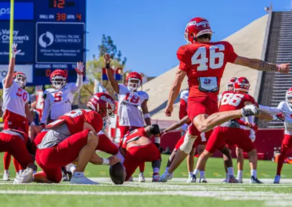 Dylan Lynch kicking a field goal.
