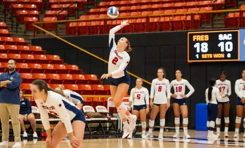 Brooke Cowie serving