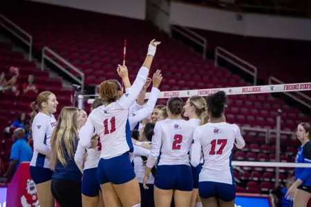 Kasey Purry leading volleyball team huddle
