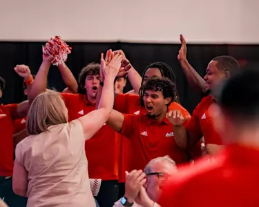 Mikey Keene celebrates a donation at the annual Kickoff Dinner