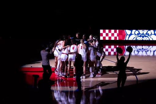 WBB on court team huddle