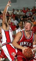 Freshman forward Luke Whitehead in a solid defensive stance against UNLV's Danny Brotherson during first half action.