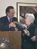 U of L President Dr. John Shumaker presents an award to Olga Peers