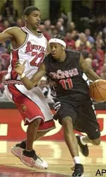 Louisville's Reece Gaines plays hard-nosed defense during Saturday's battle with the Bearcats.