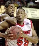 Louisville's Joseph N'Sima finds the way to the basket a tough route as he runs into the elbow of Eastern Kentucky's Chris Carswell during the first half of their intrastate matchup Wednesday.