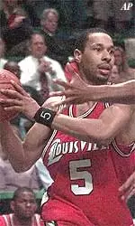 Charlotte's Kevin Johnson plays tight defense on Louisville's Marques Maybin in the second half in Charlotte, N.C., Wednesday.