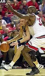 Erik Brown plays hard defense in Louisville's win over Marquette Thursday.