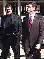 Director of Athletics Tom Jurich and Rick Pitino walk to Grawemeyer Hall