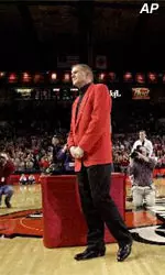 Denny Crum receives a standing ovation at center court during pre-game ceremonies.