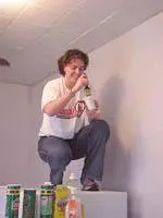 Kate O'Bryan of the Cardinal rowing team helps paint in conjunction with the YMCA Project N.O.W.