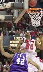 Louisville's Reece Gaines and Texas Christian's Marlon Dumont watch the ball bounce off the rim after Dumont went up for a shot during the first half Saturday.