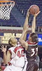 Cincinnati's Brittani Young has her shot attempt blocked by Louisville's Tiana Ford during the first half of their game Friday night.