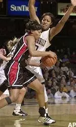 LaKisha Hoffman is guarded by Vanderbilt's Jenni Benningfield in the frist half on Monday