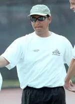 Men's tennis coach Rex Ecarma