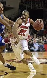 Reece Gaines drives the ball to the basket during the first half. Gaines led the Cardinals with 22 points.