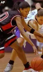 Louisiana State's Aiysha Smith and Louisville's Kim Graham fight for a loose ball during the first half.