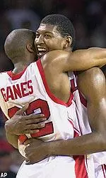 Marvin Stone and Reece Gaines celebrate in the closing moments of their 81-63 upset of intrastate rival Kentucky.