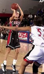 Marju Sober shoots for two as Cincinnati's Tammy Douglass defends during the first half, Saturday.