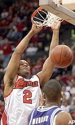 Ellis Myles dunks against TCU defender Bingo Merriex during the first half.