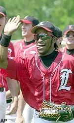 Dave Williams Jr. is congratulated by his teammates after robbing Allen Winningham of a home run in left center in the Cards' 11-9 win Sunday.