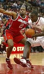 Ellis Myles slides into defensive position during the first half.