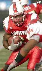 Lionel Gates looks to cut back against a Houston defender during the first half.