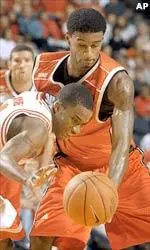 Taquan Dean fights for a rebound in Louisville's 93-63 victory.