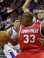 Louisville's Erik Brown works against the defense of Saint Louis' Drew Diener.