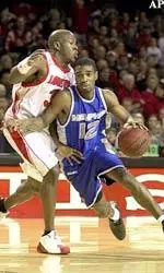 Erik Brown defends against Memphis' Billy Richmond during the first half.