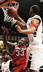 Erik Brown tries to grab a loose ball during the first half.