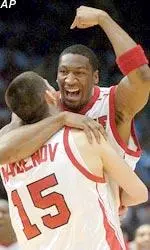 Forward Joshua Tinch celebrates with Simeon Naydenov after Louisville defeated Austin Peay 86-64 in the first round at the NCAA East Regional in Birmingham.